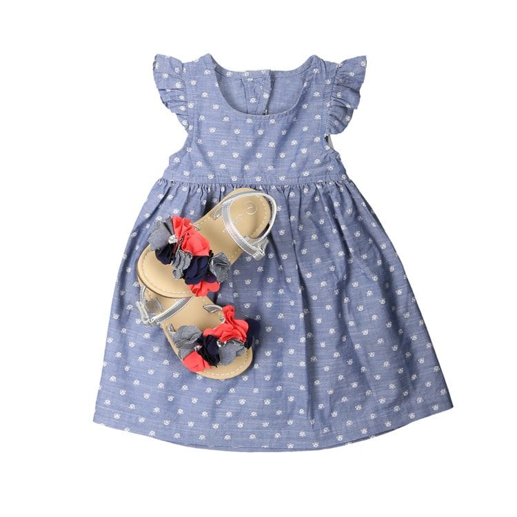 blue with white polka dots with small colorful sandals for apparel product photography example